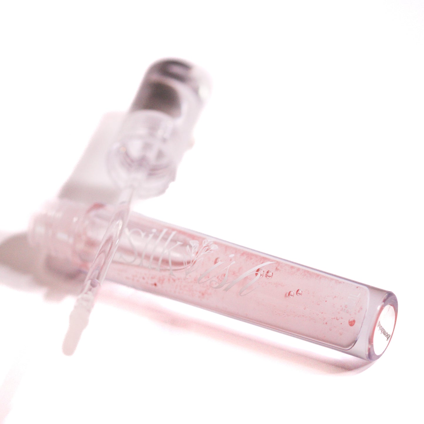 "bombshell" glossy lip plumper